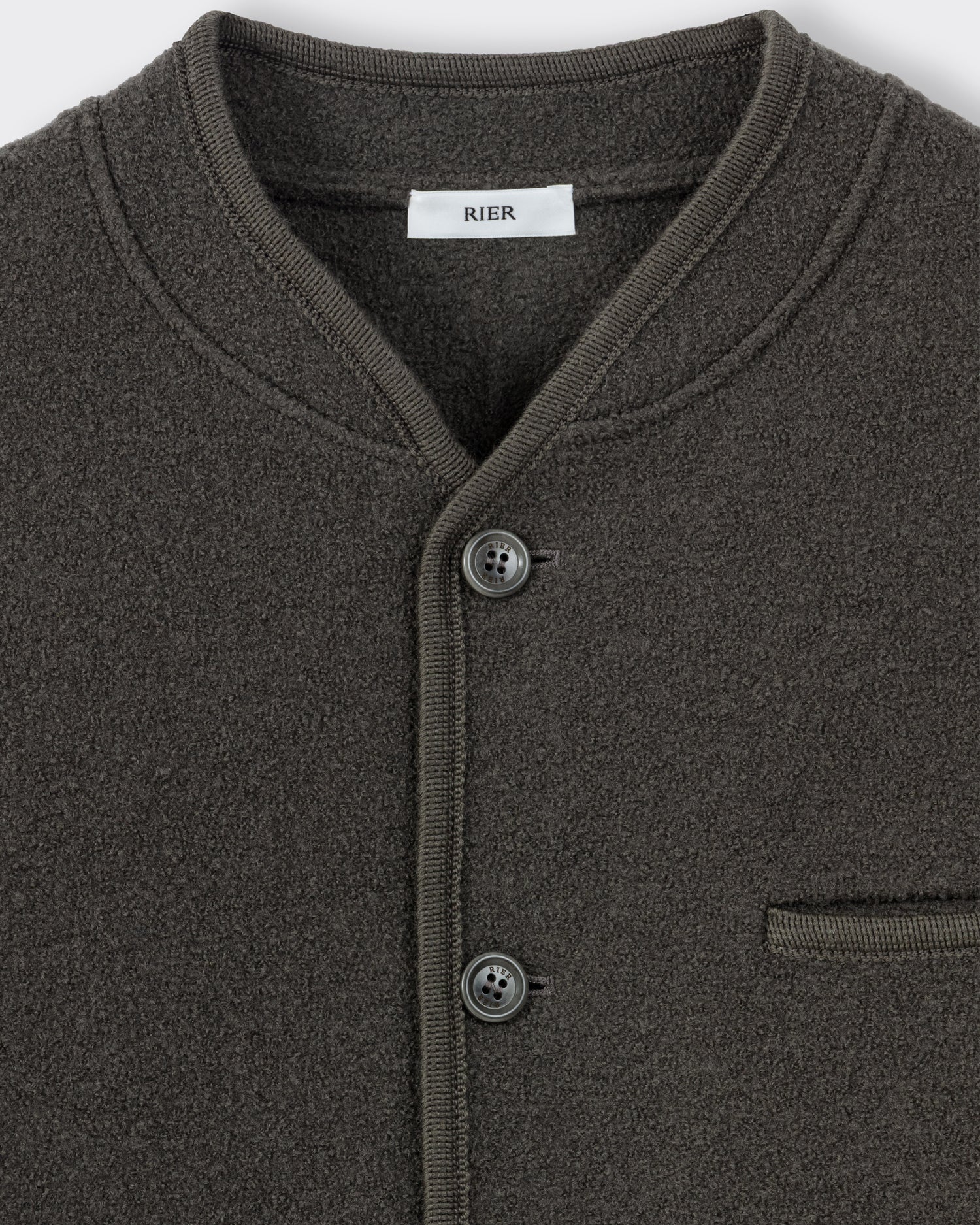 RIER Walker wool jacket in Zinc grey, close-up of the round neckline, buttons and chest pocket