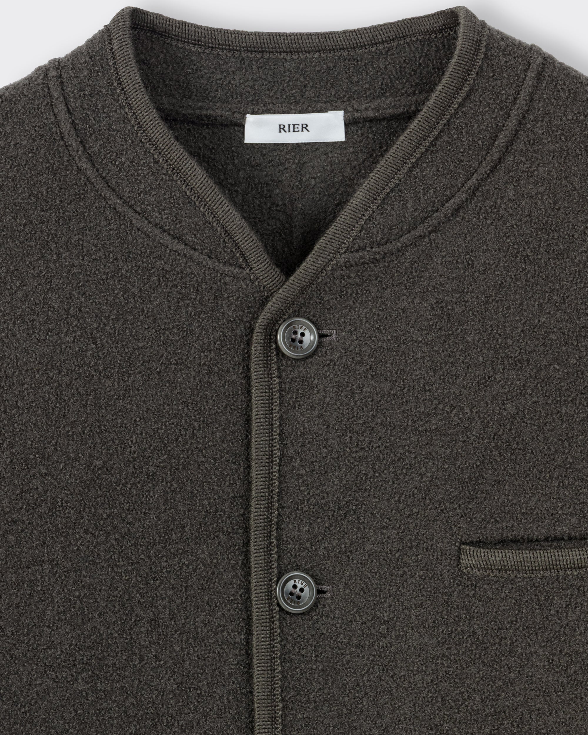 RIER Walker wool jacket in Zinc grey, close-up of the round neckline, buttons and chest pocket