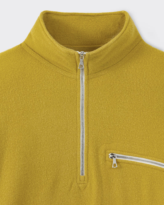 RIER half zip wool fleece in Wax mustard yellow, close-up of the Riri metal zip and zipped chest pocket