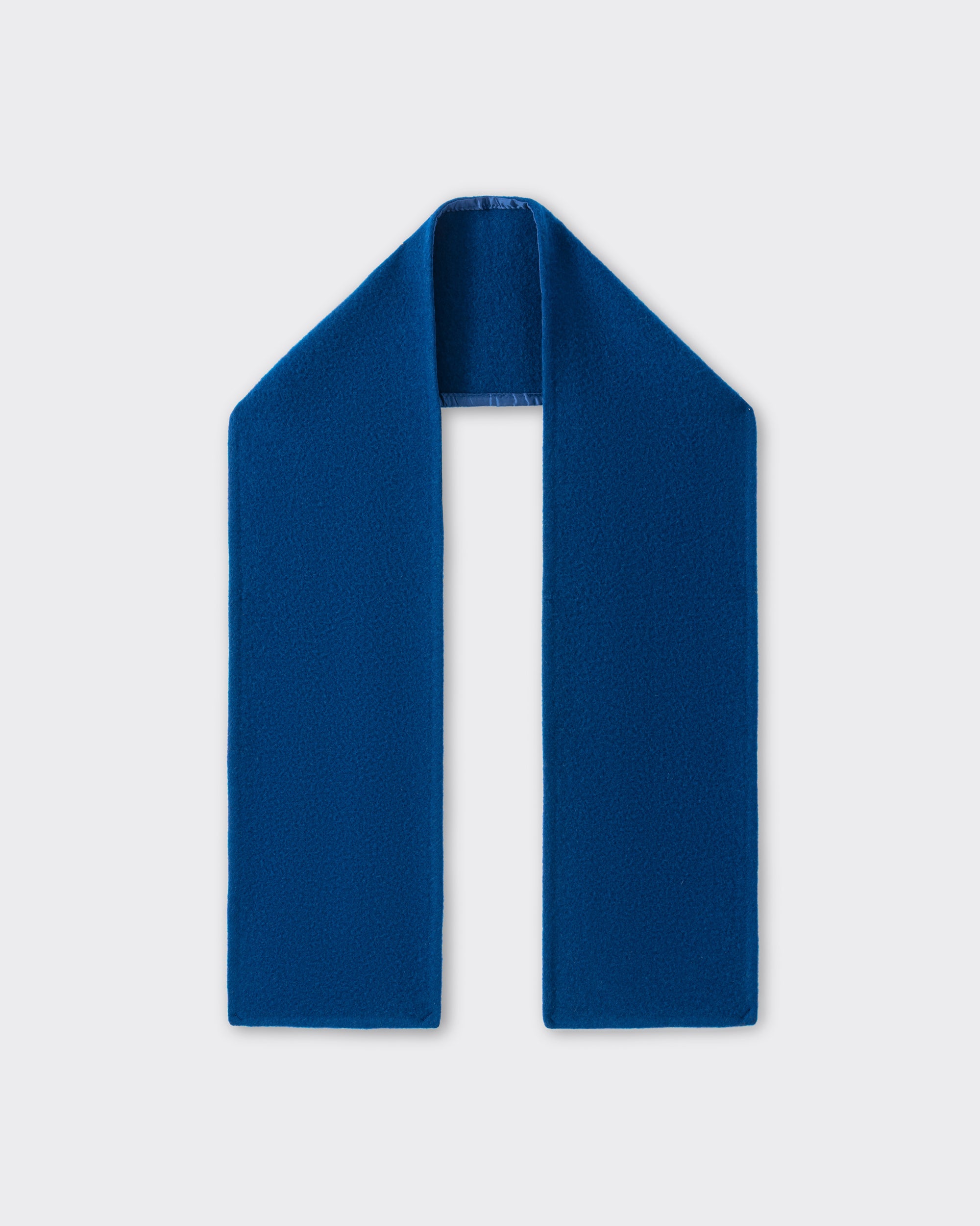RIER wool fleece scarf in indigo blue, laid flat