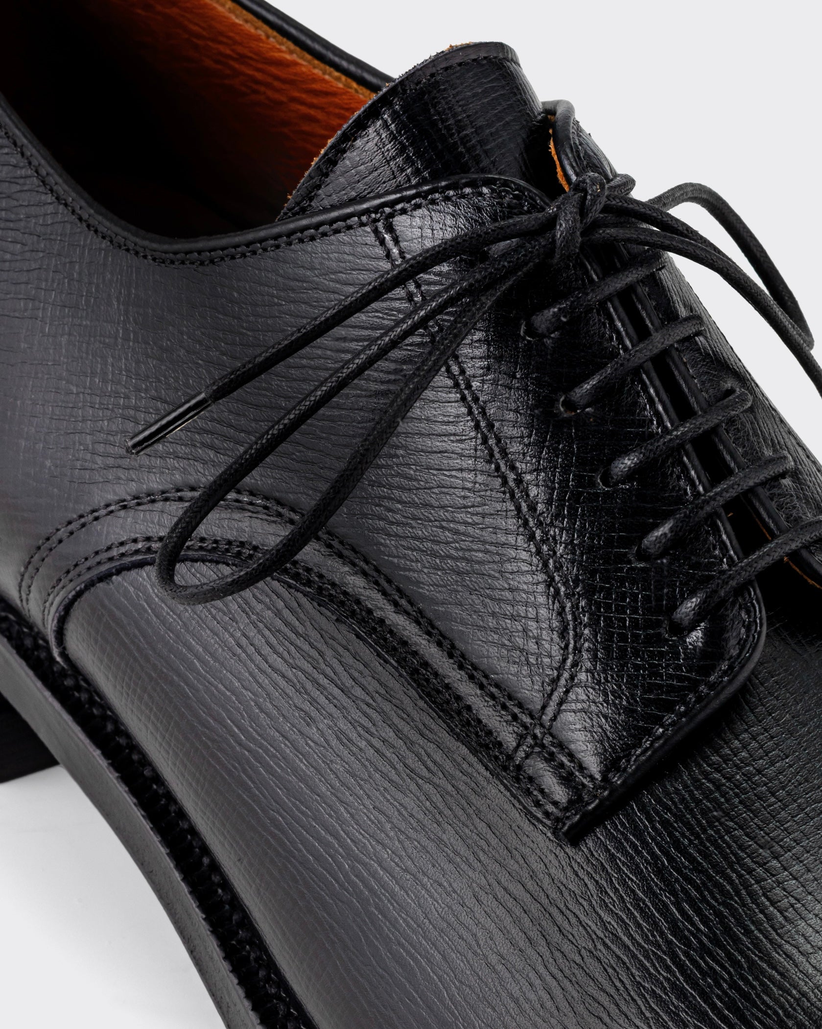 Viberg Navvy Cut Derby in black Alcazar grained calf, close-up of the leather grain