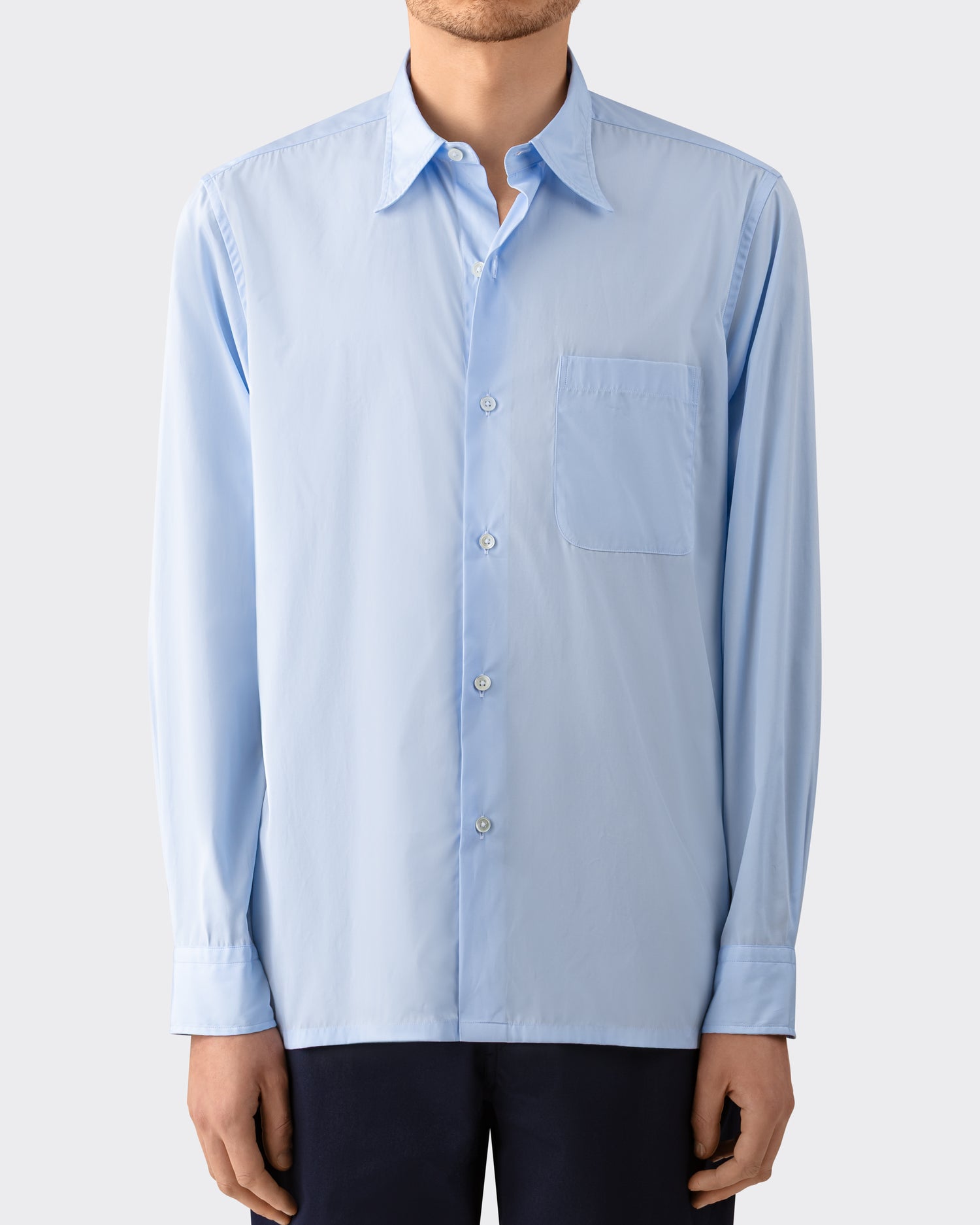 Model wearing sky blue cotton poplin shirt, BEIGE HABILLEUR PARIS