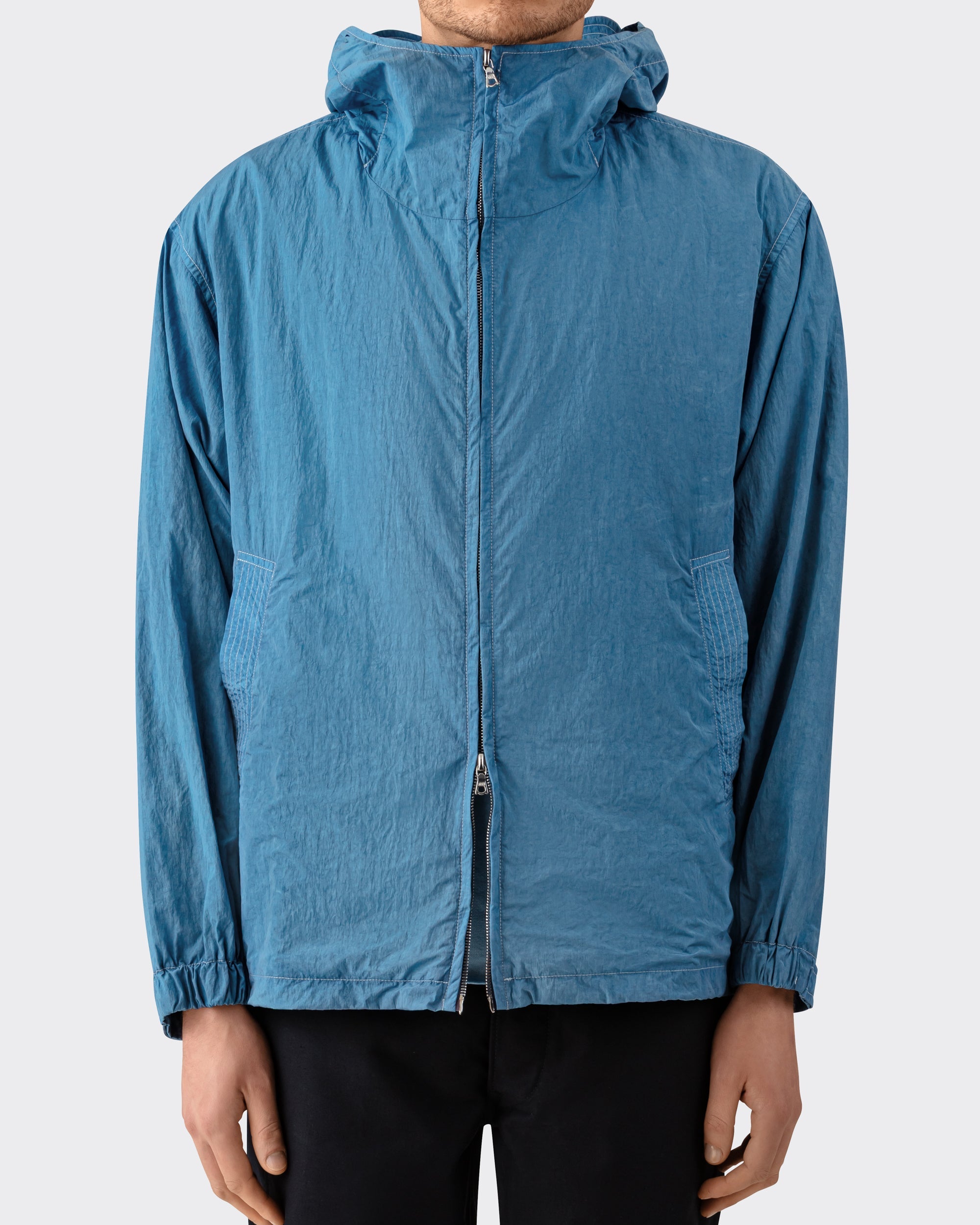 Arpenteur Kaolin nylon jacket in pastel worn by model at Beige Habilleur Paris